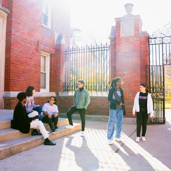 students talking near the harlan and blackstone gates